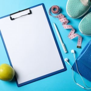 Weight loss or healthy lifestyle accessories on blue background