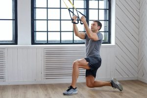 A man exercising with expanders.