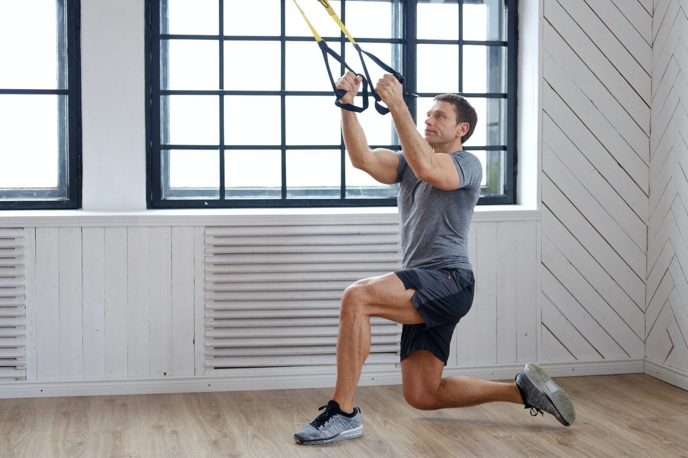 A man exercising with expanders.