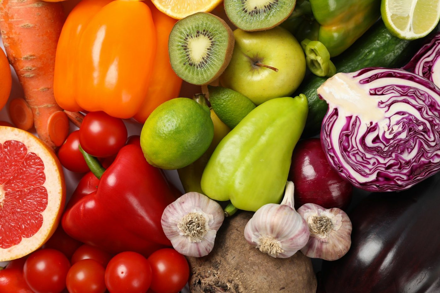 Different vegetables and fruits background, top view