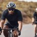 Training, energy and fitness with athlete exercise on bicycle outdoors, practice speed and enduranc