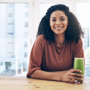 Portrait, mockup and smoothie with a black woman drinking a health beverage for a weight loss diet