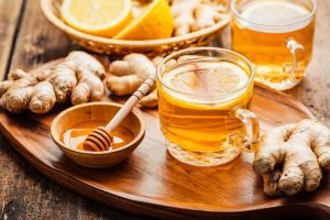 Ginger tea with lemon on a wooden table