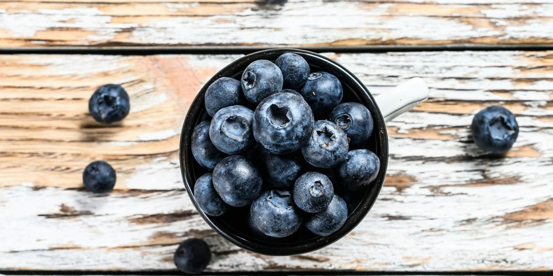 Blueberry in a white cup. antioxidant organic superfood. concept for healthy eating.