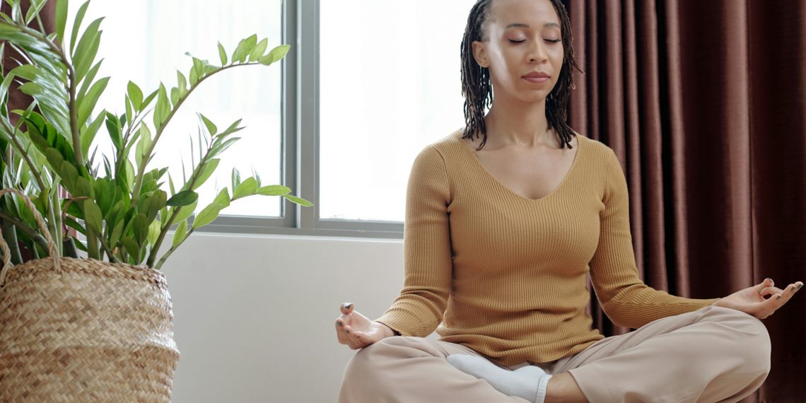 Woman Meditating to Stay Calm