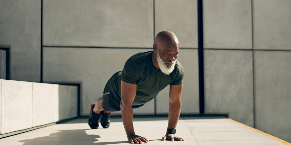 Mature, man and fitness for exercise with pushup for strength, health or wellness by outside. Afric
