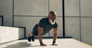 Mature, man and fitness for exercise with pushup for strength, health or wellness by outside. Afric