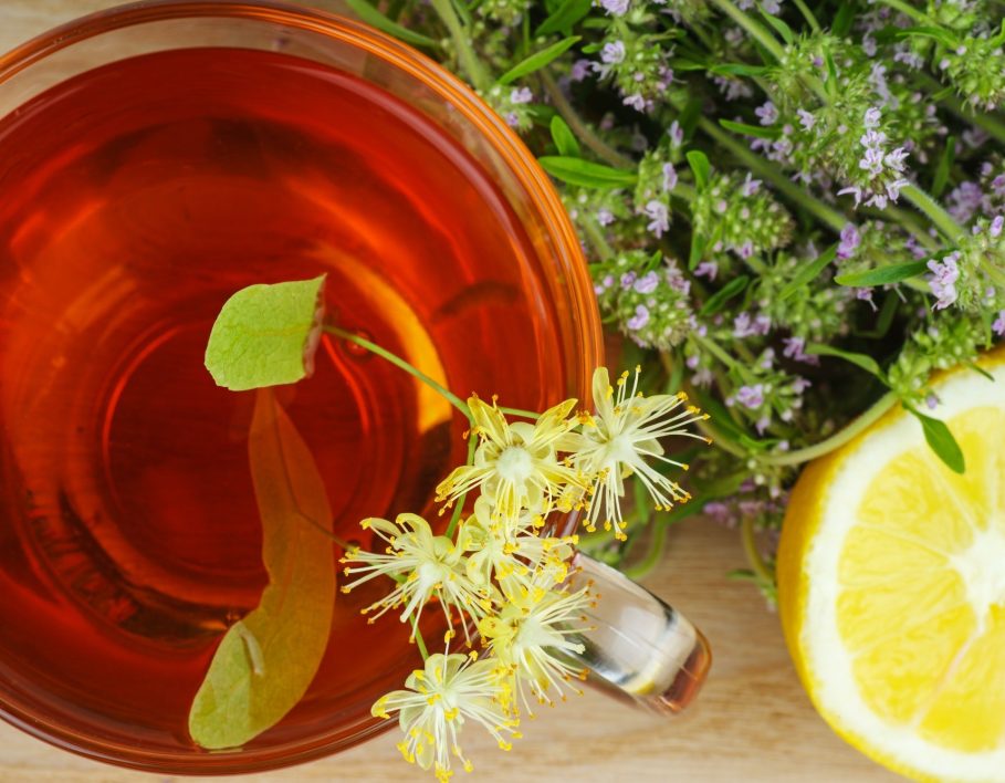 Cup of herbal tea with lemon and thyme