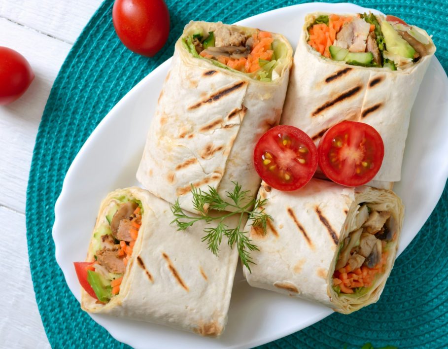 Fresh tortilla wraps with chicken, mushrooms and fresh vegetables