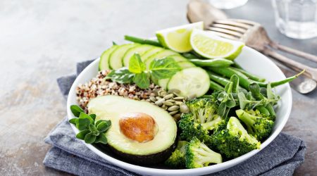 Green vegan lunch bowl with quinoa and avocado