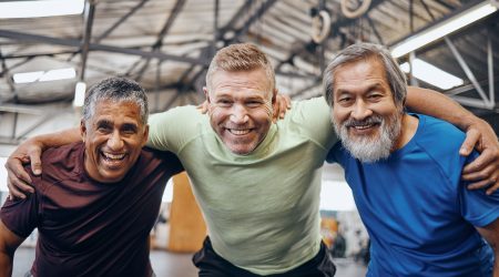Portrait, hug or mature men in workout gym, training exercise or healthcare wellness in success cel