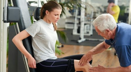 Woman with joint pain in gym