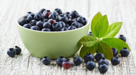 blueberry-with-leaves-on-a-wooden-white-board-2022-01-18-23-42-34-utcx1200