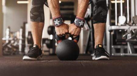 Close up photo of man strength workout training with dumbbells